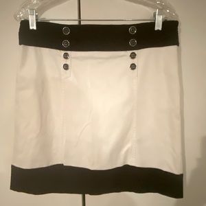 White House Black Market white skirt with black trim in good condition